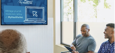 3 patients view waiting room screen showing My HealtheVet online prescription management message.