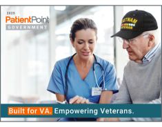 Nurse in blue scrubs speaks with an older veteran wearing a Vietnam War cap, with the text Built for VA. Empowering Veterans.